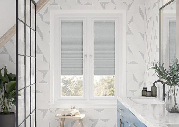 a grey perfect fit honeycomb blind in a modern bathroom, Stellar Gris