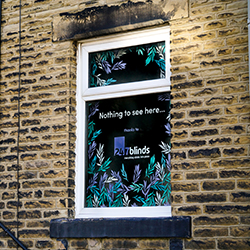 an image showing a 247 blind in a window