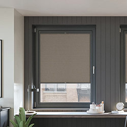 A Brown, honeycomb perfect fit blind in a dark contemporary office