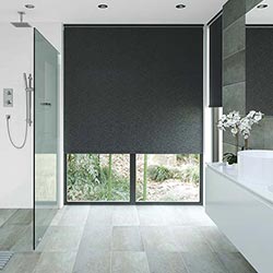 A black PVC waterproof blind adorns a bathroom sliding door. Modern in style.