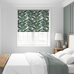 A beautiful tropical pattern roller blind in a grey bedroom