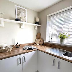 An image showing a wooden blind in a kitchen