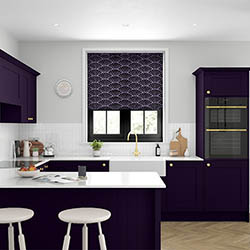 A purple patterned roller blind in a modern kitchen
