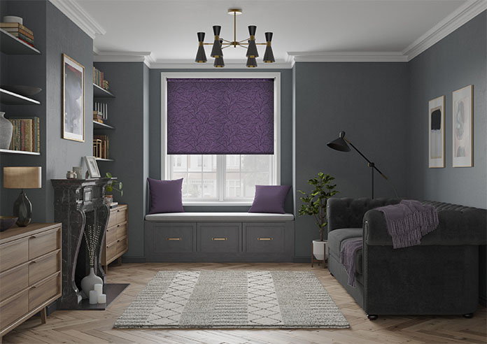 A purple floral patterned roller blind in a living room
