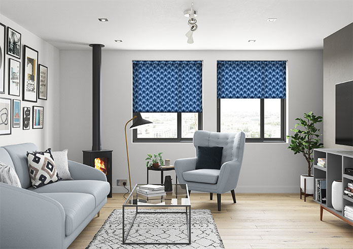 A blue patterned roller blind in a living room