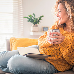 A women enjoying a brew with a book