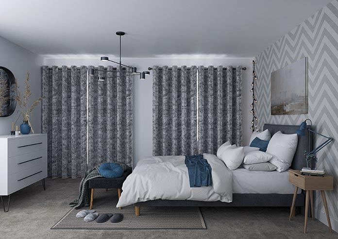A closed blackout curtain in a bedroom is perfect for mental health
