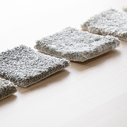 Grey carpet samples lined up for comparison
