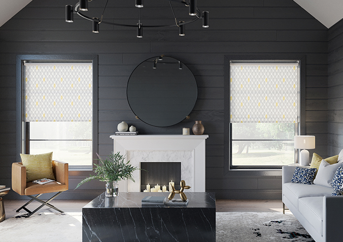 A black painted living room is shown with a white and grey pattern roller blind in the window.