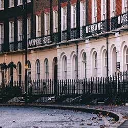 A photograph showing off a Victorian row of houses. Likely London or Bath